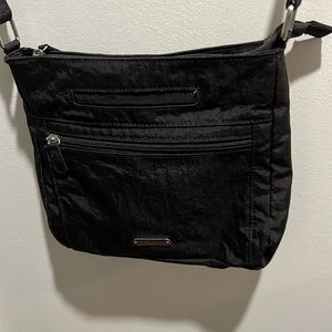 Very nice black water resistant crossbody purse.
